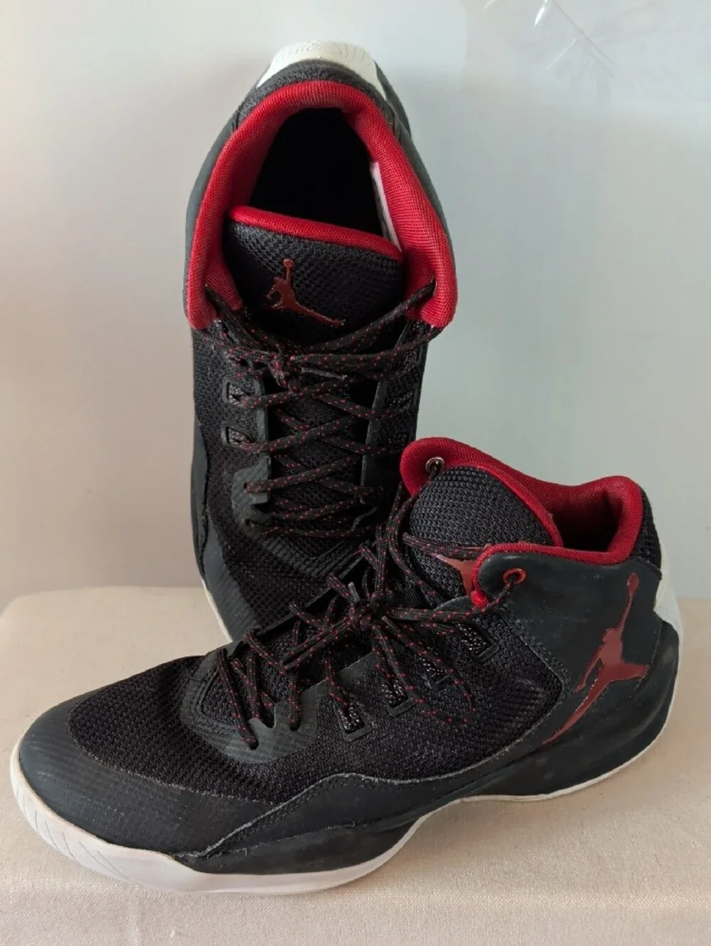 Jordan Men’s Black and Red High-Top Athletic Basketball Shoes.